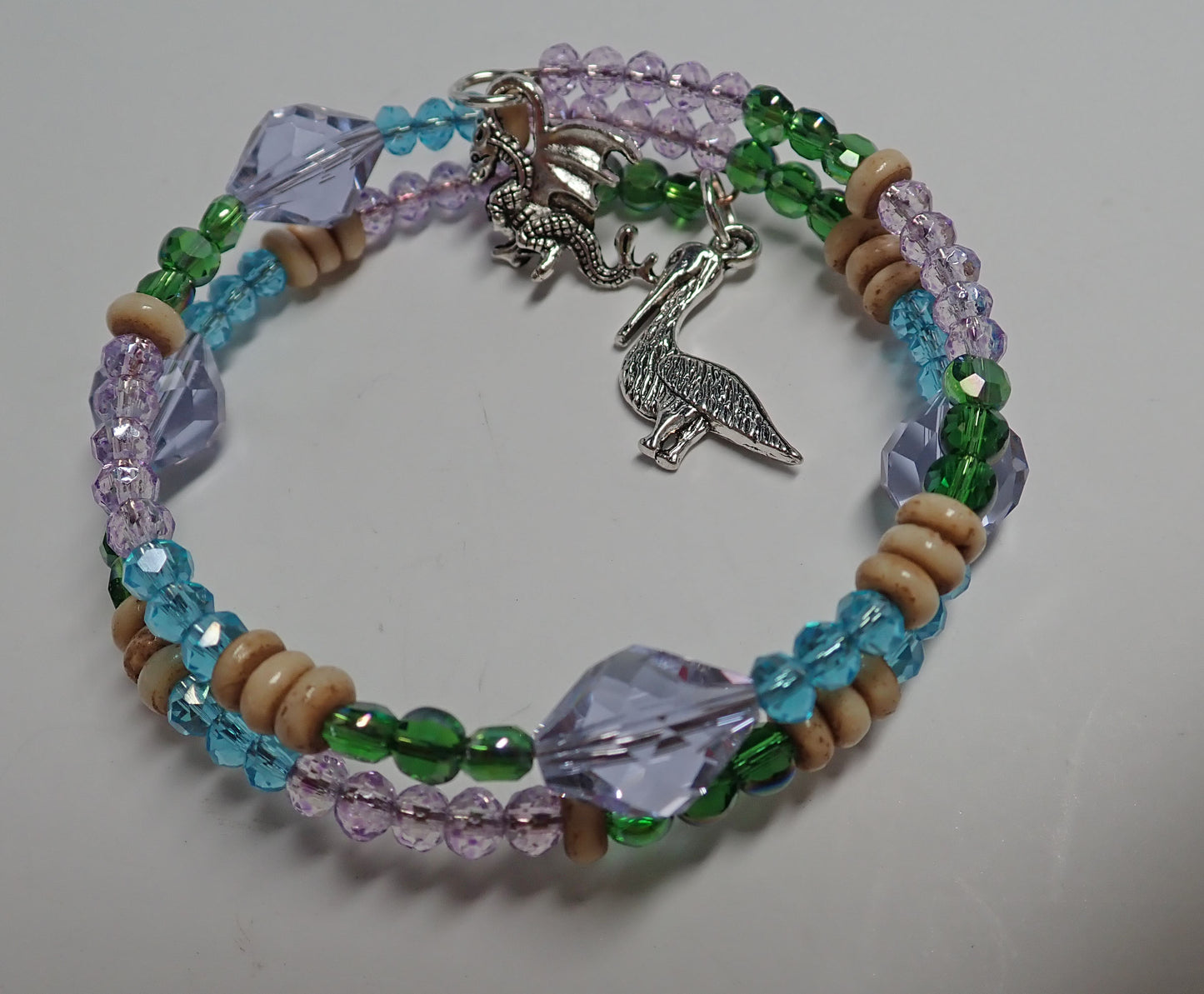 Jewelry, bracelet, double round, lavender, blue, green, wood tone, pelican charm, dragon charm